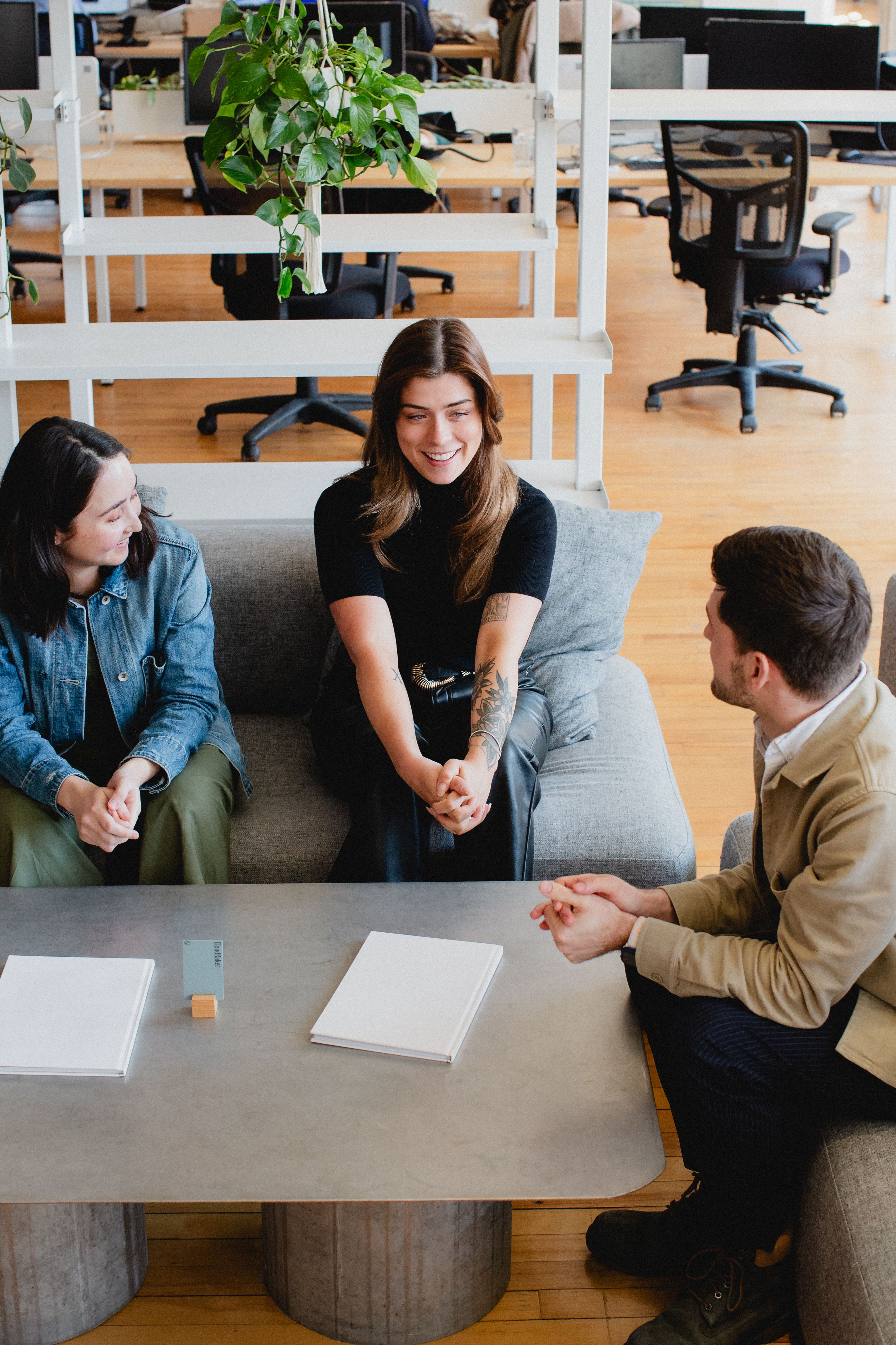 Three CloudRaker team members in a working discussion.
